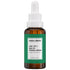 Brown serum bottle with green label on a white background