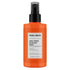Orange spray bottle of maru-derm dual-phase blow dry spray on a white background